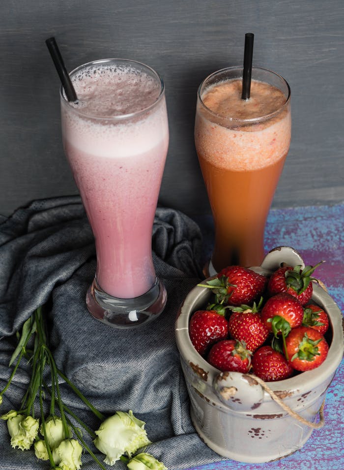 Crafting Captivating Headlines: Your awesome post title goes here Top-down view of strawberry smoothies in glasses with fresh strawberries, perfect for a healthy lifestyle.
